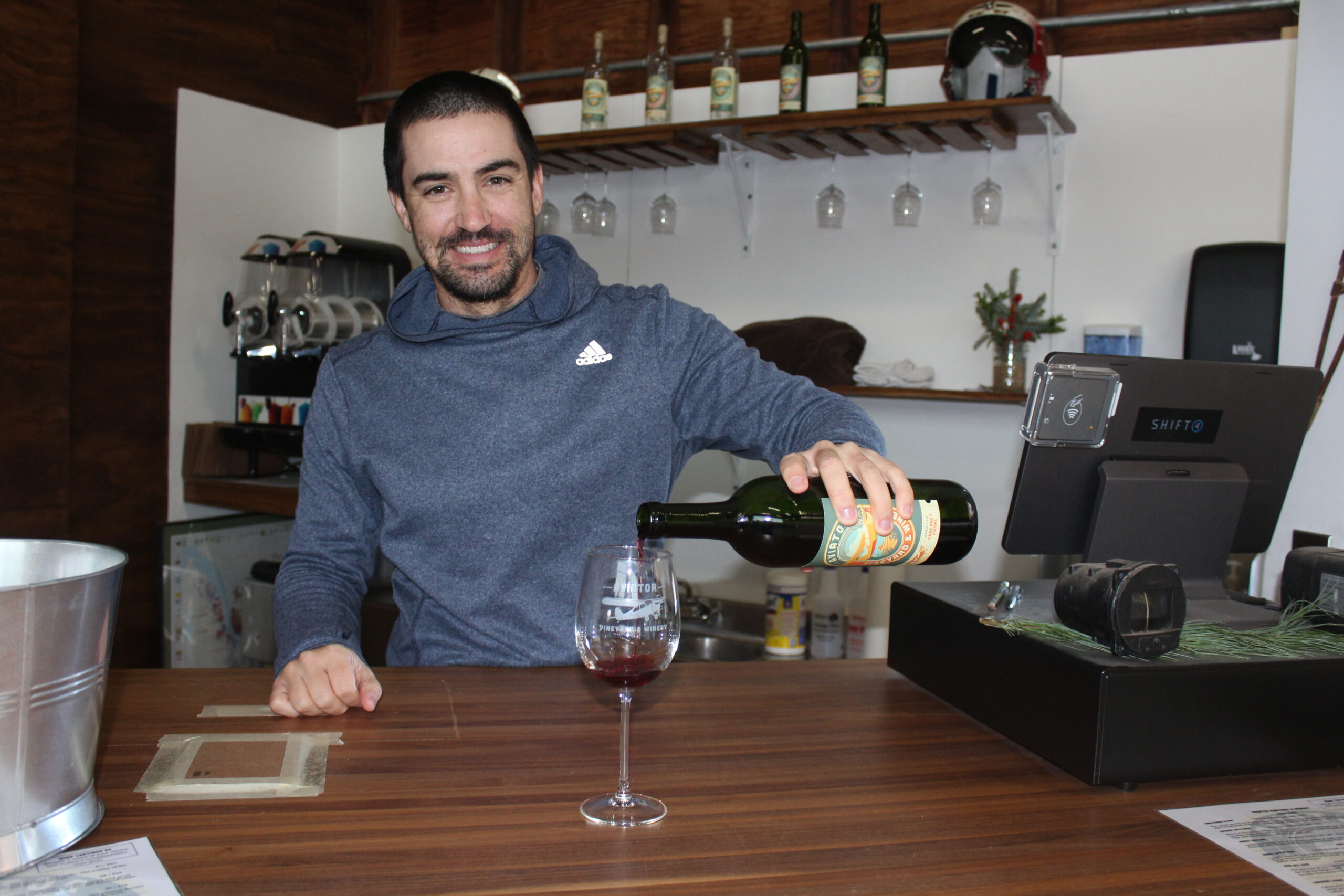 Winemaker Chris Burns pours a glass of wine at Aviator Winery.