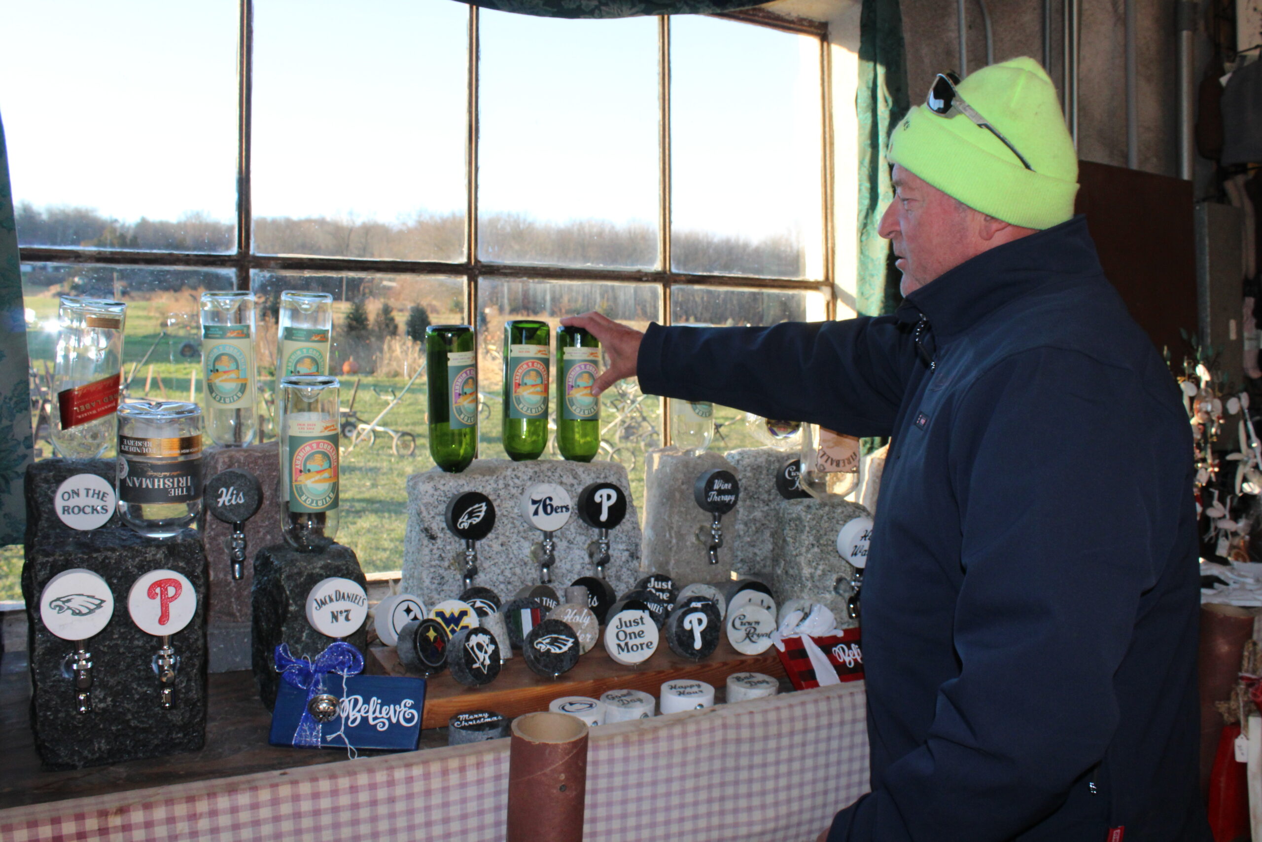 AGA Farms owner Dan Devery shows off some of the items available for purchase in the seasonal shop.